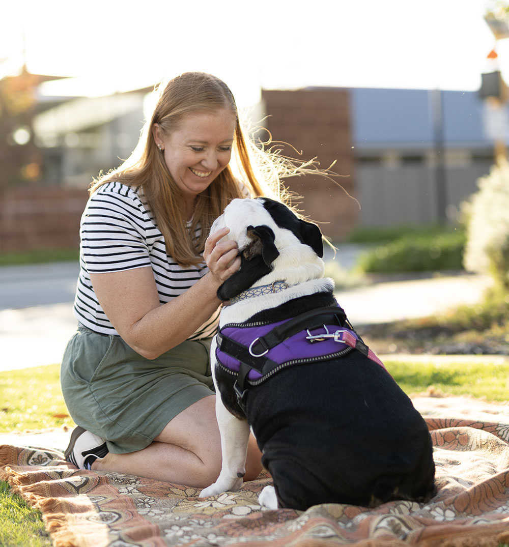 A lady with her dog, enjoying a park in Constellar land estate