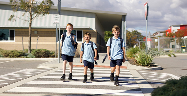 Happy children leaving the new primary school in the Consellar land development in Perth